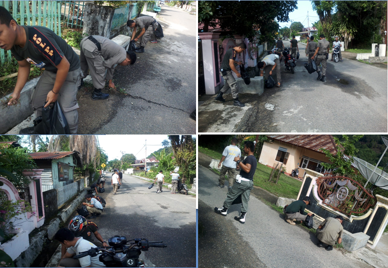 Satpol PP dan Damkar Gotong Royong  di Jalan Darwis Kota Painan